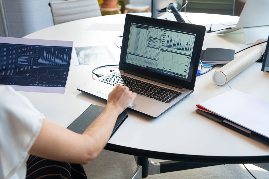 A laptop showing a network diagram